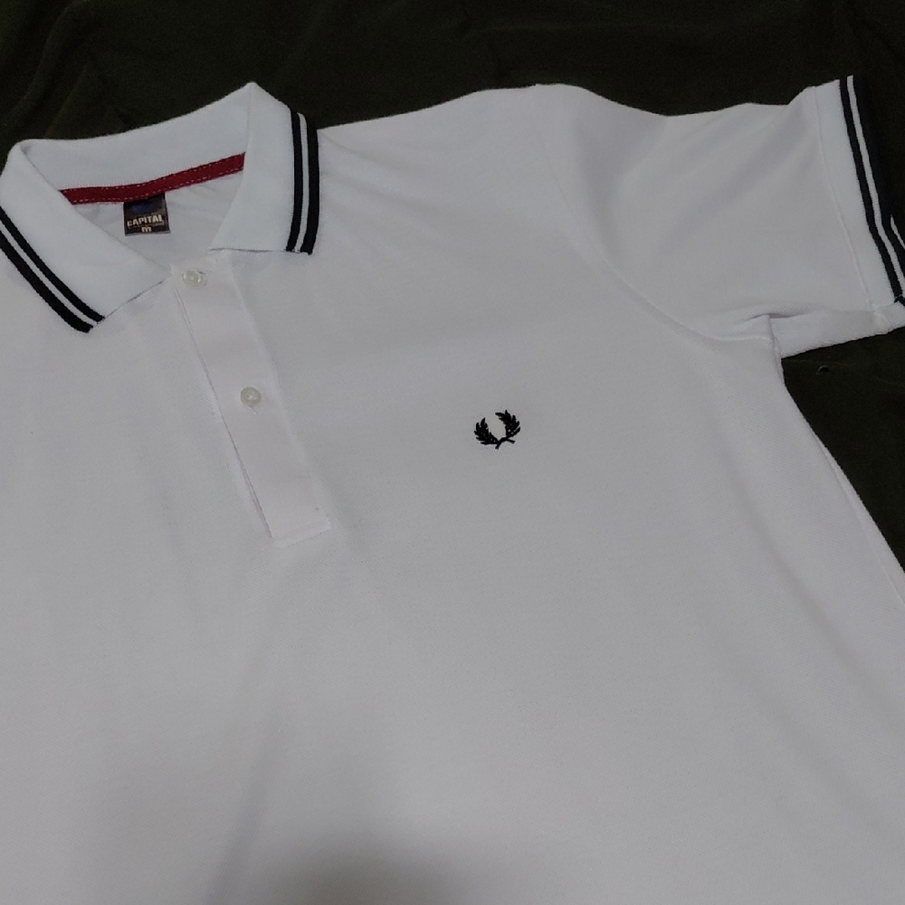 Capital Underground. White Polo With Black Trim. Medium.